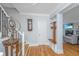 Inviting entryway with hardwood floors, coat rack, and a staircase leading to the upper level at 3738 Station Point Ct, Mount Pleasant, SC 29466
