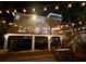 Inviting two-story home with a spacious deck illuminated by string lights, and ample parking underneath the raised home at 3738 Station Point Ct, Mount Pleasant, SC 29466