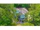 Aerial view of home featuring mature trees, a staircase leading up to a second story porch, and a light blue exterior at 3738 Station Point Ct, Mount Pleasant, SC 29466