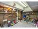 Cluttered garage with tools, bikes, and lawn equipment at 3738 Station Point Ct, Mount Pleasant, SC 29466