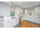 Bright kitchen featuring white cabinets, sleek countertops, and stainless steel appliances at 3738 Station Point Ct, Mount Pleasant, SC 29466