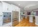 Bright, modern kitchen with stainless appliances and open to an additional dining area at 3738 Station Point Ct, Mount Pleasant, SC 29466