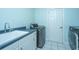 Convenient laundry room with modern appliances, sink, and access to outdoors at 3738 Station Point Ct, Mount Pleasant, SC 29466