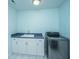 Functional laundry room with modern washer, sink, and ample storage at 3738 Station Point Ct, Mount Pleasant, SC 29466