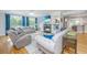 Spacious living room featuring a cozy fireplace, large windows, and comfortable seating at 3738 Station Point Ct, Mount Pleasant, SC 29466
