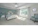 Bright and airy main bedroom featuring a large window and calming blue accents at 3738 Station Point Ct, Mount Pleasant, SC 29466