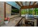 Outdoor kitchen with a stainless steel grill, tile countertop, and outdoor television for entertaining at 3738 Station Point Ct, Mount Pleasant, SC 29466