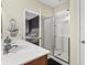 Bathroom features glass-enclosed shower, single vanity, and view of bedroom at 3901 Poplar Grove Pl, Summerville, SC 29483