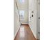 Hallway with hardwood floors and natural light from a window at 3901 Poplar Grove Pl, Summerville, SC 29483