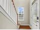 Bright foyer with hardwood floors, a window offering natural light, and a paneled front door at 3901 Poplar Grove Pl, Summerville, SC 29483