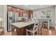 Modern kitchen with granite countertops, stainless steel appliances, and eat-in island at 3901 Poplar Grove Pl, Summerville, SC 29483
