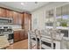 Well-lit kitchen and dining area with modern appliances and light-colored dining set at 3901 Poplar Grove Pl, Summerville, SC 29483
