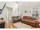 Bright living room with hardwood floors, tall ceilings, and neutral tones throughout at 3901 Poplar Grove Pl, Summerville, SC 29483
