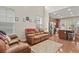 Open-concept living room and kitchen featuring stainless steel appliances and a cozy seating area at 3901 Poplar Grove Pl, Summerville, SC 29483