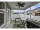 Cozy screened-in patio with wicker furniture and ceiling fan at 3901 Poplar Grove Pl, Summerville, SC 29483