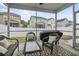 Screened-in patio with wicker furniture set and view of fenced backyard at 3901 Poplar Grove Pl, Summerville, SC 29483