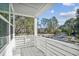 This home features a white balcony with a view of the outdoors and a glimpse of the neighborhood at 399 Claret Cup Way, Charleston, SC 29414