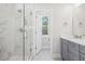 Modern bathroom with a glass-enclosed shower, sleek vanity, and ample natural light at 399 Claret Cup Way, Charleston, SC 29414