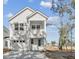 Charming two-story home with a balcony, garage, and well-manicured landscaping at 399 Claret Cup Way, Charleston, SC 29414