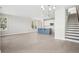 Bright and airy living room with hardwood floors, a blue island, and a staircase at 399 Claret Cup Way, Charleston, SC 29414
