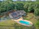Aerial view of a single-Gathering home featuring an inground pool and deck with patio furniture at 4292 Cloudmont Dr, Hollywood, SC 29449