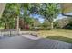 Backyard deck with railing provides a scenic view of the manicured lawn and waterfront at 4292 Cloudmont Dr, Hollywood, SC 29449
