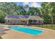 Large backyard features a pool, patio, and lush landscaping, perfect for outdoor enjoyment at 4292 Cloudmont Dr, Hollywood, SC 29449