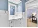 Charming bathroom with white wainscoting, vanity sink with storage, and access to an adjacent bedroom at 4292 Cloudmont Dr, Hollywood, SC 29449