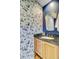 Charming half bathroom featuring unique wallpaper and granite countertops at 4292 Cloudmont Dr, Hollywood, SC 29449