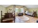 Charming bedroom featuring two twin beds, hardwood floors, and bright windows at 4292 Cloudmont Dr, Hollywood, SC 29449