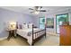 Cozy bedroom showcasing natural light, ceiling fan, and vintage furniture offers a relaxing retreat at 4292 Cloudmont Dr, Hollywood, SC 29449