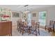 Charming dining room with wooden table, chairs, built-in shelving, and natural light at 4292 Cloudmont Dr, Hollywood, SC 29449