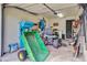 A well-lit garage featuring lawn equipment and storage shelves for organization at 4292 Cloudmont Dr, Hollywood, SC 29449