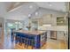 Bright, open kitchen with a central island, stainless steel appliances, and vaulted ceiling at 4292 Cloudmont Dr, Hollywood, SC 29449