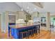 Stylish kitchen with a blue island, stainless steel appliances, and vaulted ceilings at 4292 Cloudmont Dr, Hollywood, SC 29449