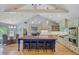 Modern kitchen featuring a large island with seating, stainless steel appliances, and plenty of cabinet space at 4292 Cloudmont Dr, Hollywood, SC 29449