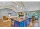 Open floor plan showcasing the kitchen island, vaulted ceilings, and hardwood floors at 4292 Cloudmont Dr, Hollywood, SC 29449