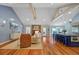 Open-concept living space with vaulted ceilings, exposed beams, and modern furnishings at 4292 Cloudmont Dr, Hollywood, SC 29449