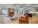 Spacious living area with fireplace, comfortable seating, and an open kitchen concept at 4292 Cloudmont Dr, Hollywood, SC 29449