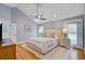 Spacious main bedroom with vaulted ceiling, ceiling fan, hardwood floors and ensuite access at 4292 Cloudmont Dr, Hollywood, SC 29449