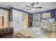 Bright home office features double doors, dual monitors, built-in shelving, and abundant natural light at 4292 Cloudmont Dr, Hollywood, SC 29449