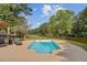 Sparkling in-ground pool offering a refreshing oasis with lounge chairs and lake views at 4292 Cloudmont Dr, Hollywood, SC 29449