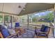 Comfortable screened porch with patio furniture and picturesque backyard view at 4292 Cloudmont Dr, Hollywood, SC 29449