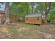 Backyard featuring mature trees and wooden storage shed at 4546 Holly St, North Charleston, SC 29405