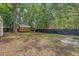 Large backyard features mature trees, grass and a storage shed at 4546 Holly St, North Charleston, SC 29405