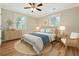 Stylishly decorated bedroom with hardwood floors, natural lighting, and ceiling fan at 4546 Holly St, North Charleston, SC 29405