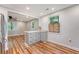 Modern kitchen with granite countertop, and a view to living room at 4546 Holly St, North Charleston, SC 29405