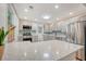 Renovated kitchen with stainless steel refrigerator and view to breakfast bar at 4546 Holly St, North Charleston, SC 29405