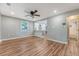 A bright living room featuring wood floors that extend into an open layout, showcasing modern living at 4546 Holly St, North Charleston, SC 29405