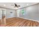 Bright living room with wood floors, ceiling fan, and a view to front yard at 4546 Holly St, North Charleston, SC 29405